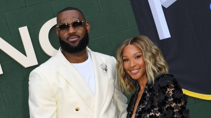 LeBron James and his wife Savannah James at a red carpet event.